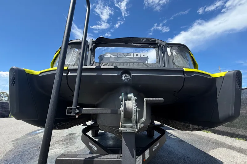 Slide: The Image of 2023 Sea-Doo Switch Cruise 21 on trailer under clear blue sky. - 11