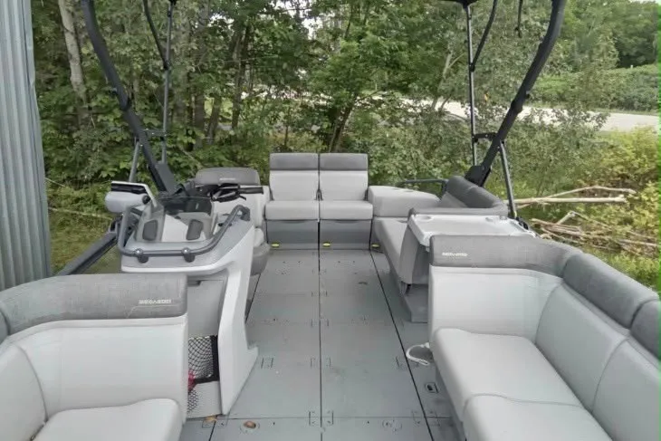 Slide: The Image of 2023 Sea-Doo Switch Cruise 21 pontoon boat interior with spacious seating and modern design. - 12