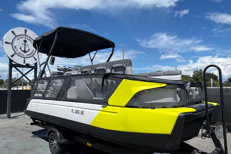The Image of 2023 Sea-Doo Switch Cruise 21 pontoon boat on trailer, displayed outdoors. - 0