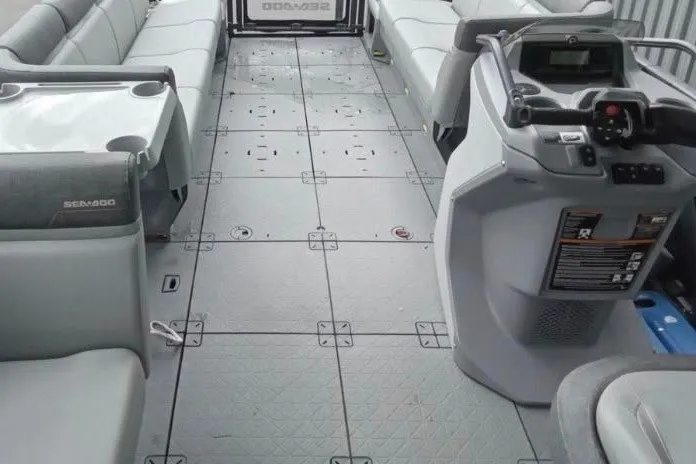 Slide: The Image of 2023 Sea-Doo Switch Cruise 21 interior with spacious seating and modern controls. - 7