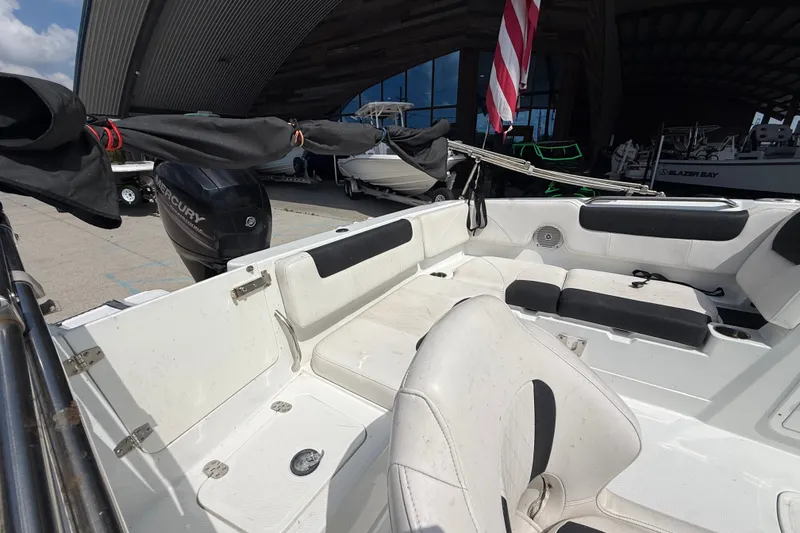 Slide: The Image of Interior of a 2017 Tahoe 1950 boat with seating and Mercury engine. - 10