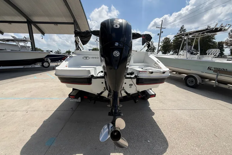 Slide: The Image of Rear view of a 2017 Tahoe 1950 boat with an outboard motor. - 3