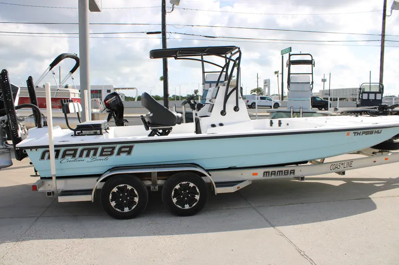 The Image of 2026 Mamba 24 Cat Elite boat on trailer, displayed outdoors. - 0