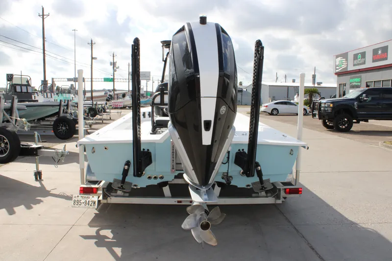 Slide: The Image of 2026 Mamba 24 Cat Elite boat with powerful outboard motor, displayed at dealership. - 17