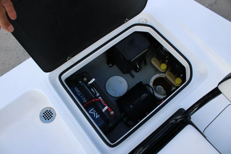 Slide: The Image of Open hatch of 2026 Mamba 24 Cat Elite showing battery and components. - 16