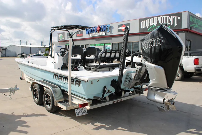 Slide: The Image of 2026 Mamba 24 Cat Elite boat with powerful engine at dealership. - 18