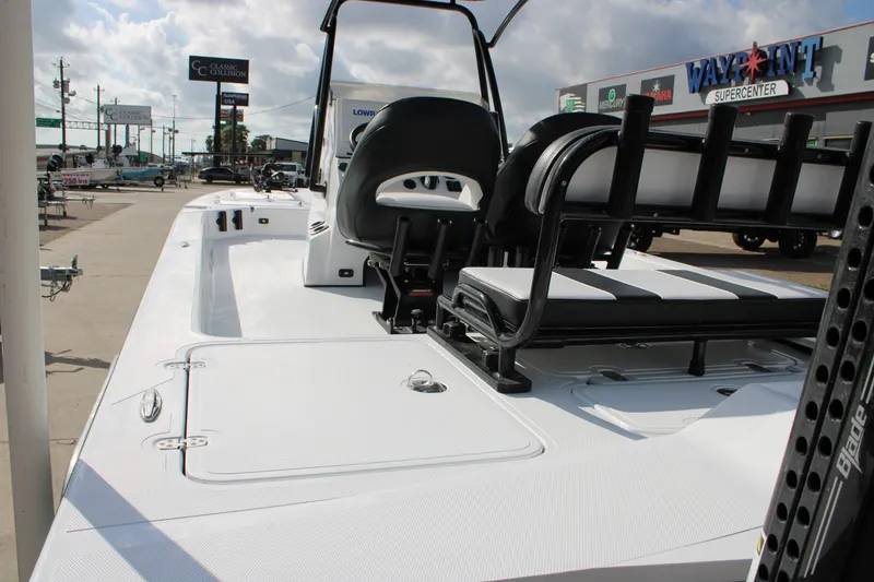 Slide: The Image of 2026 Mamba 24 Cat Elite boat interior at dealership, showcasing seating and deck features. - 19