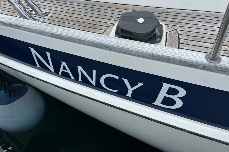Slide: The Image of Sailboat "Nancy B" docked, Hallberg-Rassy 42F, 1997 model, with wooden deck details. - 78