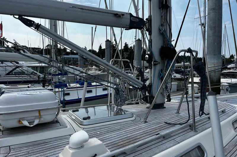 Slide: The Image of Deck view of a 1997 Hallberg-Rassy 42F sailboat in a marina. - 75