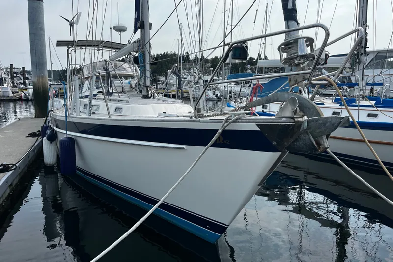 The Image of Sailboat Hallberg-Rassy 42F, 1997 model, docked at marina with blue fenders. - 0