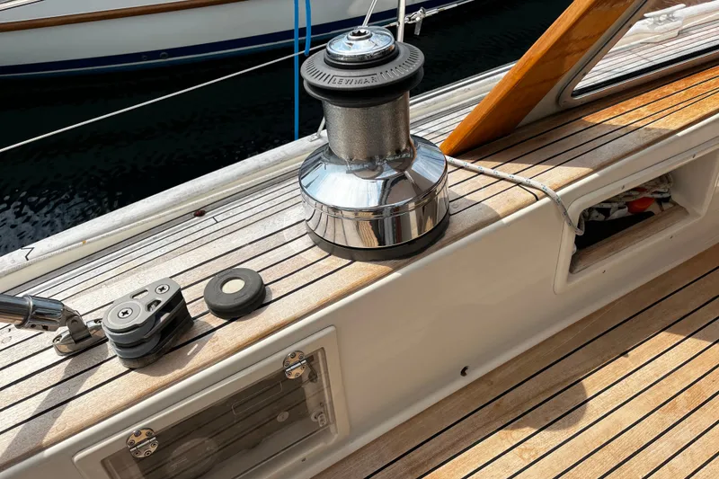 Slide: The Image of Deck of 1997 Hallberg-Rassy 42F yacht with winch and wooden finish. - 62