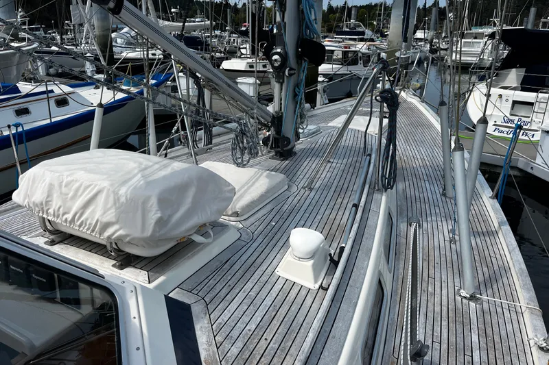 Slide: The Image of Deck view of a 1997 Hallberg-Rassy 42F sailboat docked in a marina. - 35