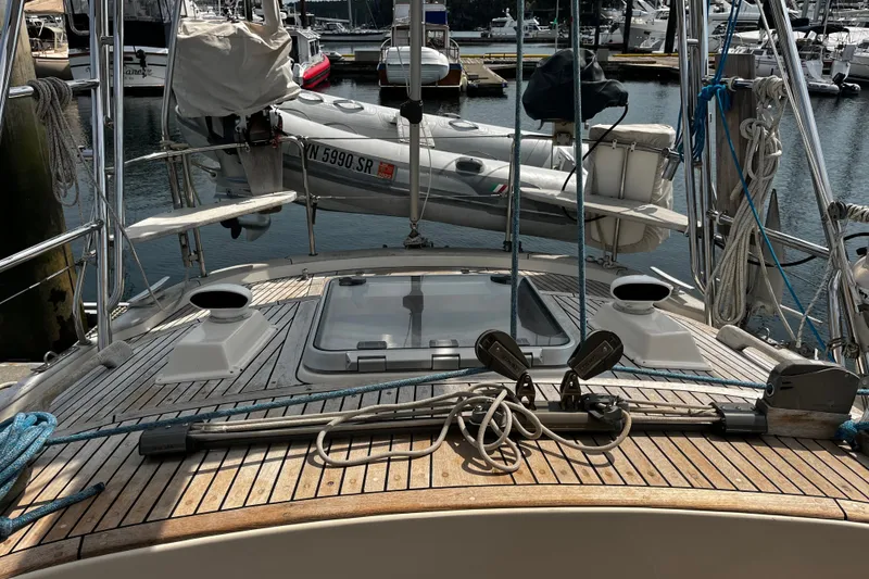 Slide: The Image of Deck view of a 1997 Hallberg-Rassy 42F sailboat in a marina. - 53