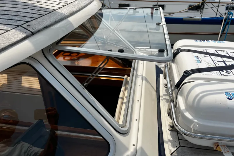 Slide: The Image of 1997 Hallberg-Rassy 42F yacht deck with open hatch and secured equipment. - 88