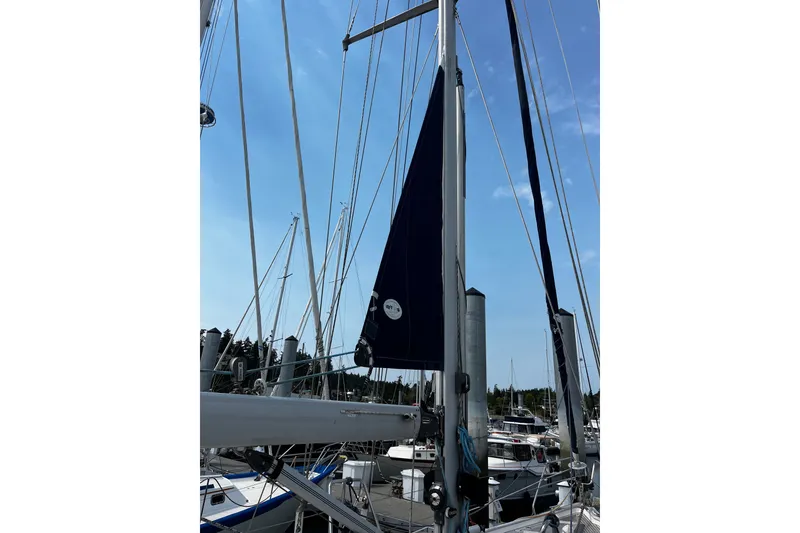 Slide: The Image of Sailboat mast and rigging of 1997 Hallberg-Rassy 42F in marina setting. - 36