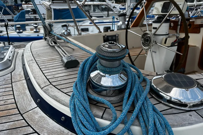 Slide: The Image of Deck of 1997 Hallberg-Rassy 42F sailboat with winch and blue rope. - 79