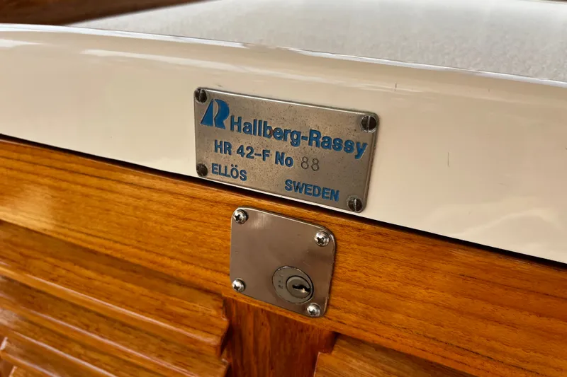 Slide: The Image of Hallberg-Rassy 42F yacht nameplate, model 1997, showcasing craftsmanship from Ellös, Sweden. - 51
