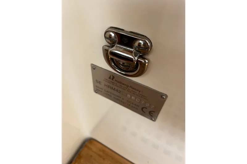 Slide: The Image of Hallberg-Rassy 42F 1997 model identification plate with latch detail. - 91