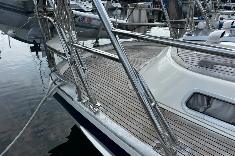 Slide: The Image of Deck of 1997 Hallberg-Rassy 42F sailboat with polished stainless steel railings. - 76