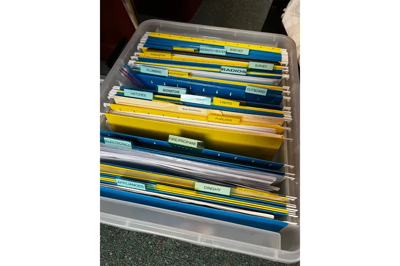 Slide: The Image of Organized boat maintenance files in a plastic container for a 1997 Hallberg-Rassy 42F yacht. - 30