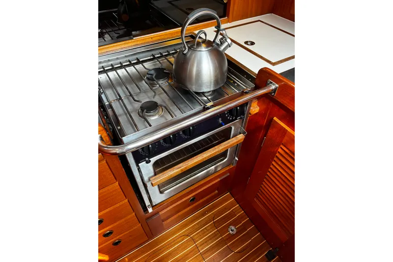Slide: The Image of Galley kitchen in 1997 Hallberg-Rassy 42F yacht with stove and kettle. - 21