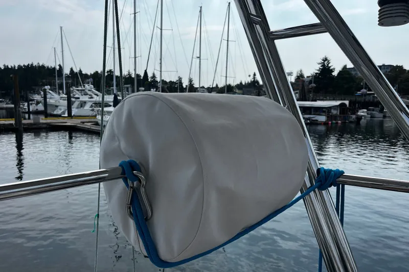 Slide: The Image of White fender on Hallberg-Rassy 42F sailboat, docked at marina, 1997 model. - 68