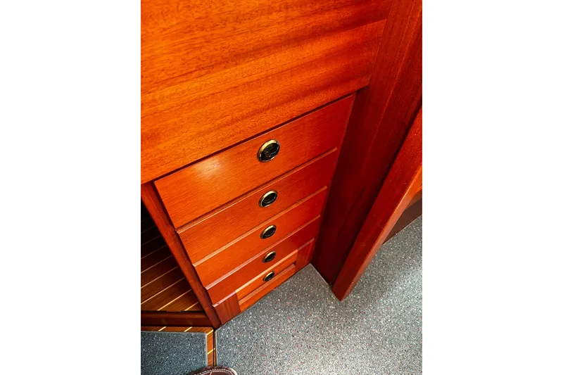 Slide: The Image of Wooden drawers inside a 1997 Hallberg-Rassy 42F yacht, showcasing elegant craftsmanship. - 27