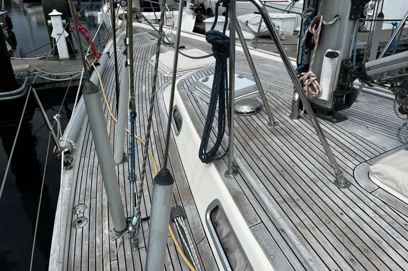 Slide: The Image of Deck of 1997 Hallberg-Rassy 42F sailboat with wooden finish and rigging details. - 47