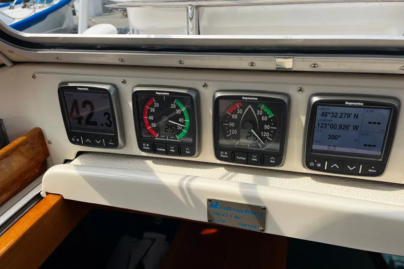 Slide: The Image of Control panel of a 1997 Hallberg-Rassy 42F sailboat with Raymarine instruments. - 90