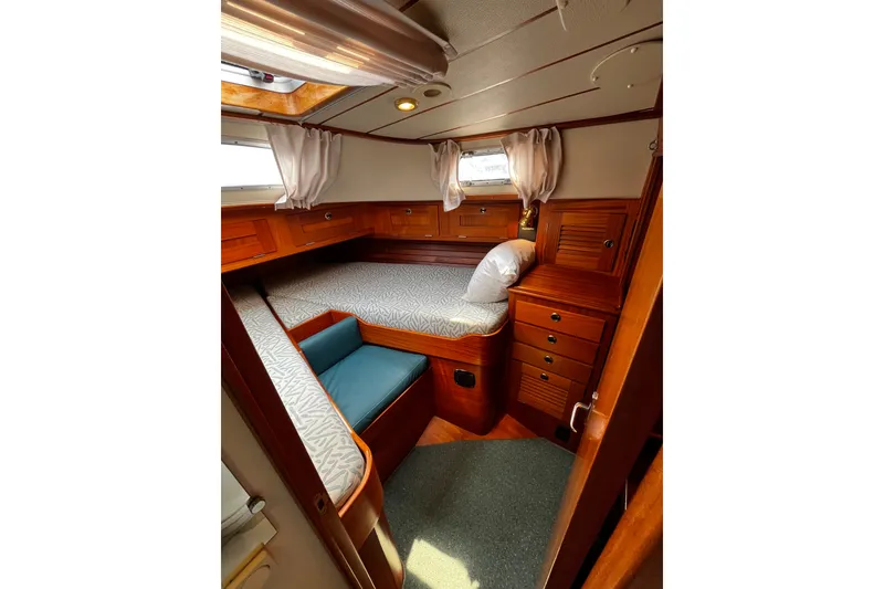 Slide: The Image of Cozy cabin interior of 1997 Hallberg-Rassy 42F sailboat with wooden furnishings. - 16