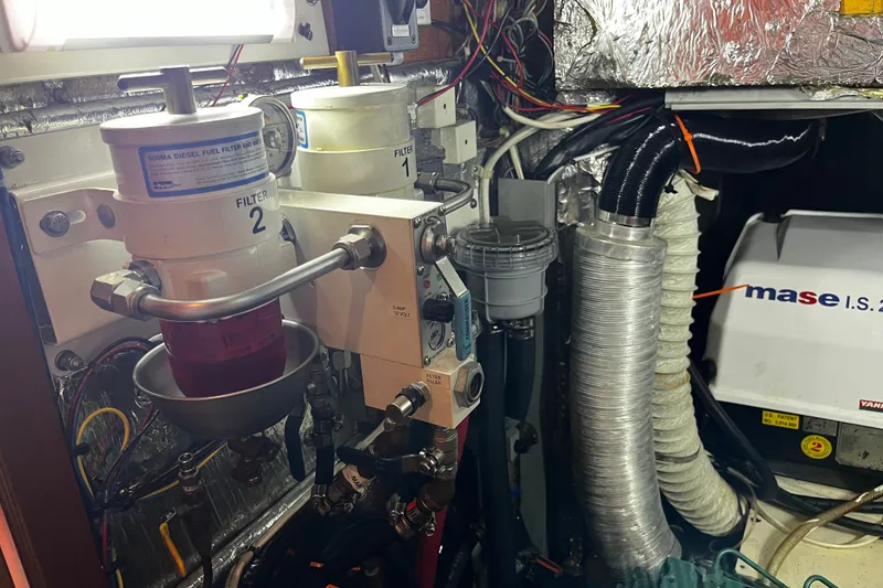 Slide: The Image of Engine room of a 1997 Hallberg-Rassy 42F yacht with fuel filters and generator. - 33
