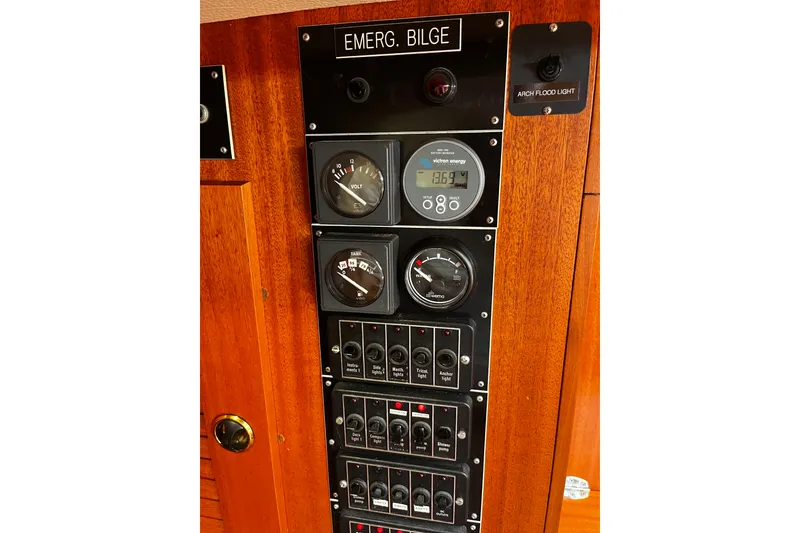Slide: The Image of Control panel of a 1997 Hallberg-Rassy 42F yacht with gauges and switches. - 23