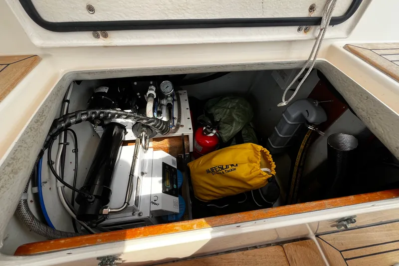 Slide: The Image of Storage compartment of a 1997 Hallberg-Rassy 42F yacht with equipment and supplies. - 83