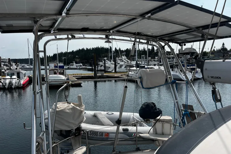 Slide: The Image of Sailboat docked at marina, Hallberg-Rassy 42F, 1997 model, with solar panels and dinghy. - 63