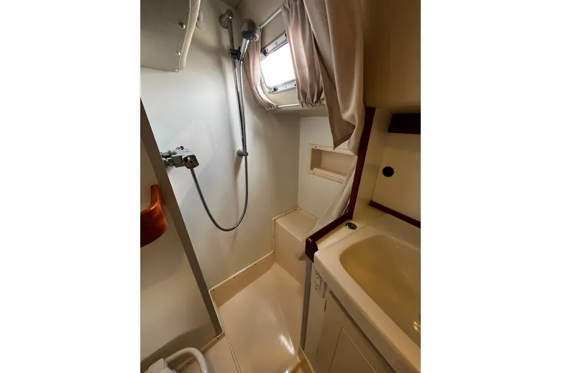 Slide: The Image of Bathroom interior of 1997 Hallberg-Rassy 42F yacht, featuring shower and sink. - 19