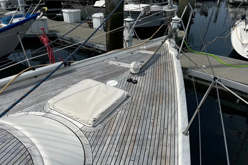 Slide: The Image of Deck of a 1997 Hallberg-Rassy 42F yacht docked at a marina. - 38