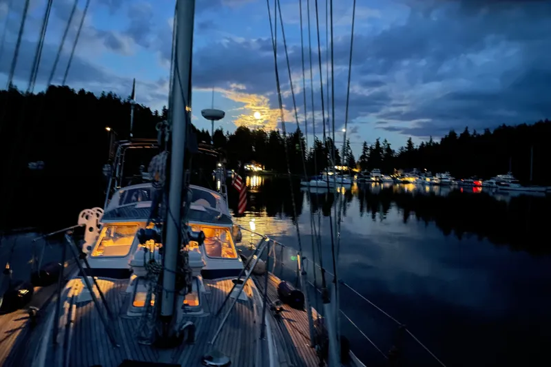 Slide: The Image of Sailboat Hallberg-Rassy 42F, 1997 model, moored at night with illuminated cabin. - 97