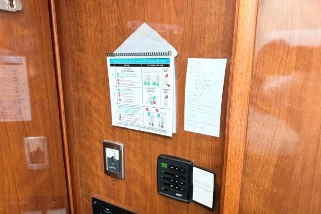 Slide: The Image of Control panel and notes on a 2004 Sea Ray 390 Motor Yacht wooden interior. - 11