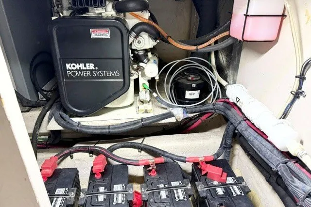 Slide: The Image of Engine room of 2004 Sea Ray 390 Motor Yacht with Kohler power system and batteries. - 48