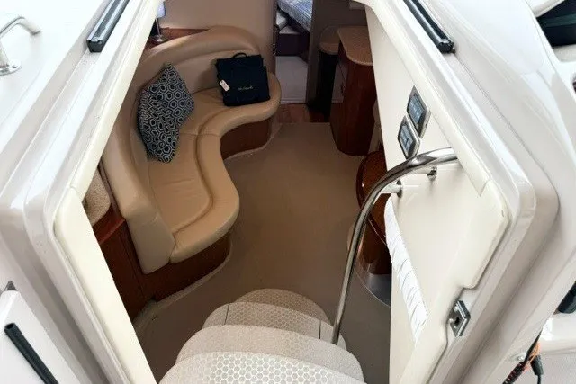 Slide: The Image of Interior view of 2004 Sea Ray 390 Motor Yacht with beige seating and modern design. - 7
