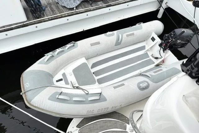 Slide: The Image of Inflatable boat docked beside a 2004 Sea Ray 390 Motor Yacht. - 40
