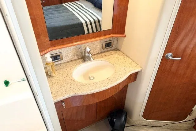 Slide: The Image of Luxurious bathroom vanity in 2004 Sea Ray 390 Motor Yacht with granite countertop. - 15