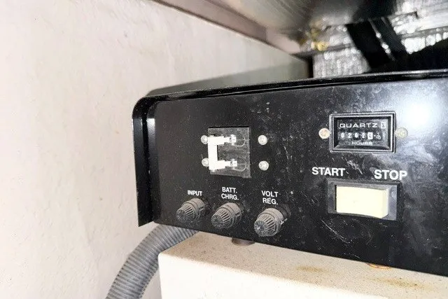 Slide: The Image of Control panel of a 2004 Sea Ray 390 Motor Yacht with switches and dials. - 55