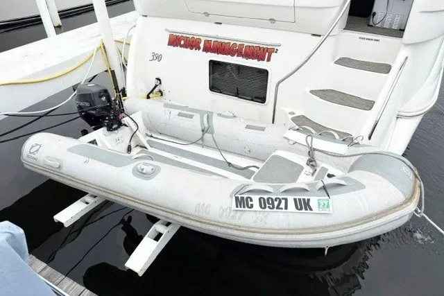 Slide: The Image of 2004 Sea Ray 390 Motor Yacht with inflatable dinghy attached at the stern. - 43