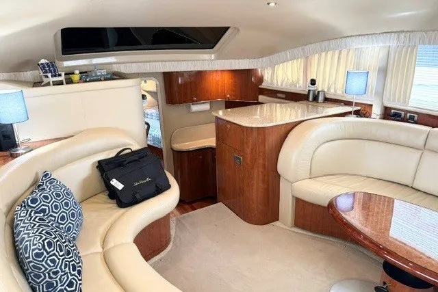 Slide: The Image of Luxurious interior of a 2004 Sea Ray 390 Motor Yacht with elegant seating and wood finishes. - 33