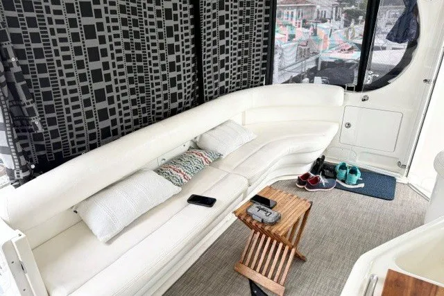 Slide: The Image of Luxurious interior of 2004 Sea Ray 390 Motor Yacht with white seating and decor. - 39
