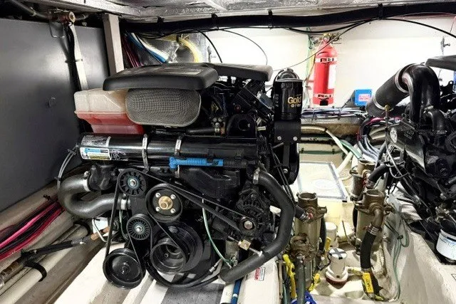 Slide: The Image of Engine room of 2004 Sea Ray 390 Motor Yacht, featuring detailed mechanical components. - 50