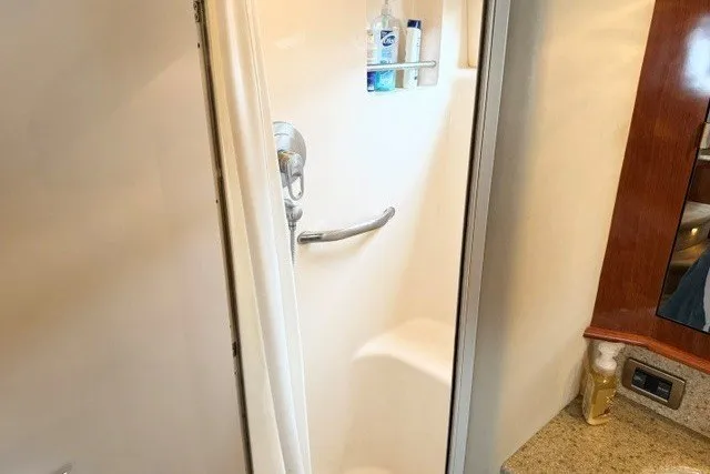 Slide: The Image of Shower area in 2004 Sea Ray 390 Motor Yacht with toiletries and sleek design. - 14