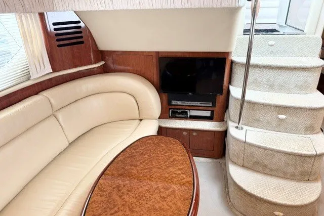 Slide: The Image of Luxurious interior of 2004 Sea Ray 390 Motor Yacht with plush seating and entertainment area. - 35