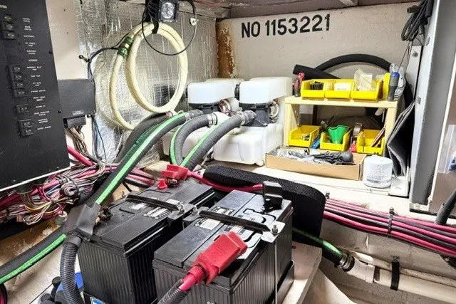 Slide: The Image of Engine room of a 2004 Sea Ray 390 Motor Yacht with batteries and wiring. - 52